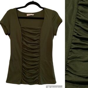 Ricki’s size M, dark green, with rushing in the front